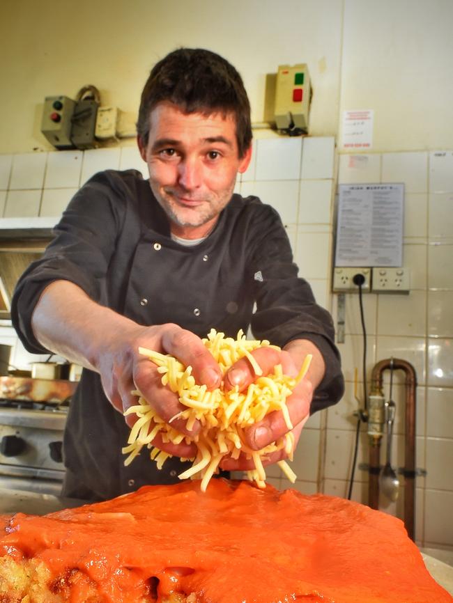 Danny Brick prepares giant parma named the Godfather at the Irish Murphy's. Picture: Tony Gough.