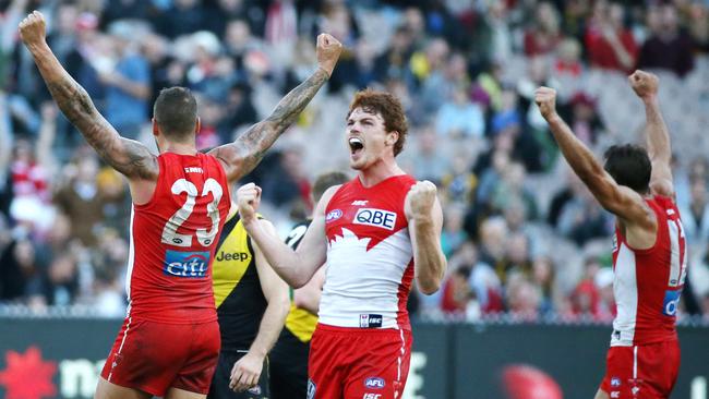 Gary Rohan, Lance Franklin and Josh Kennedy celebrate on the final siren. Picture: George Salpigtidis