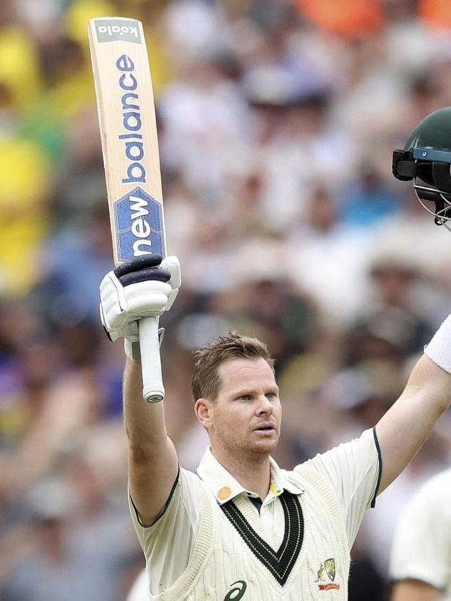 Smith salutes the MCG crowd after reaching triple figures.