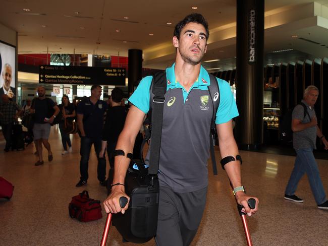 Injured cricketer Mitchell Starc arrives at Sydney Airport. Picture: Jane Dempster
