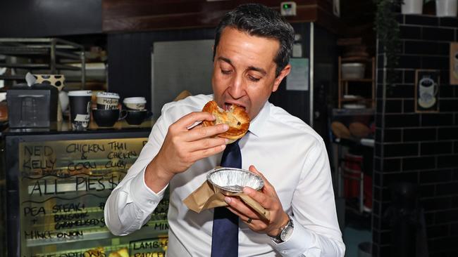 Queensland Opposition Leader David Crisafulli enjoys a meat pie at the Noosaville Bakery and Cafe. Picture: Tertius Pickard