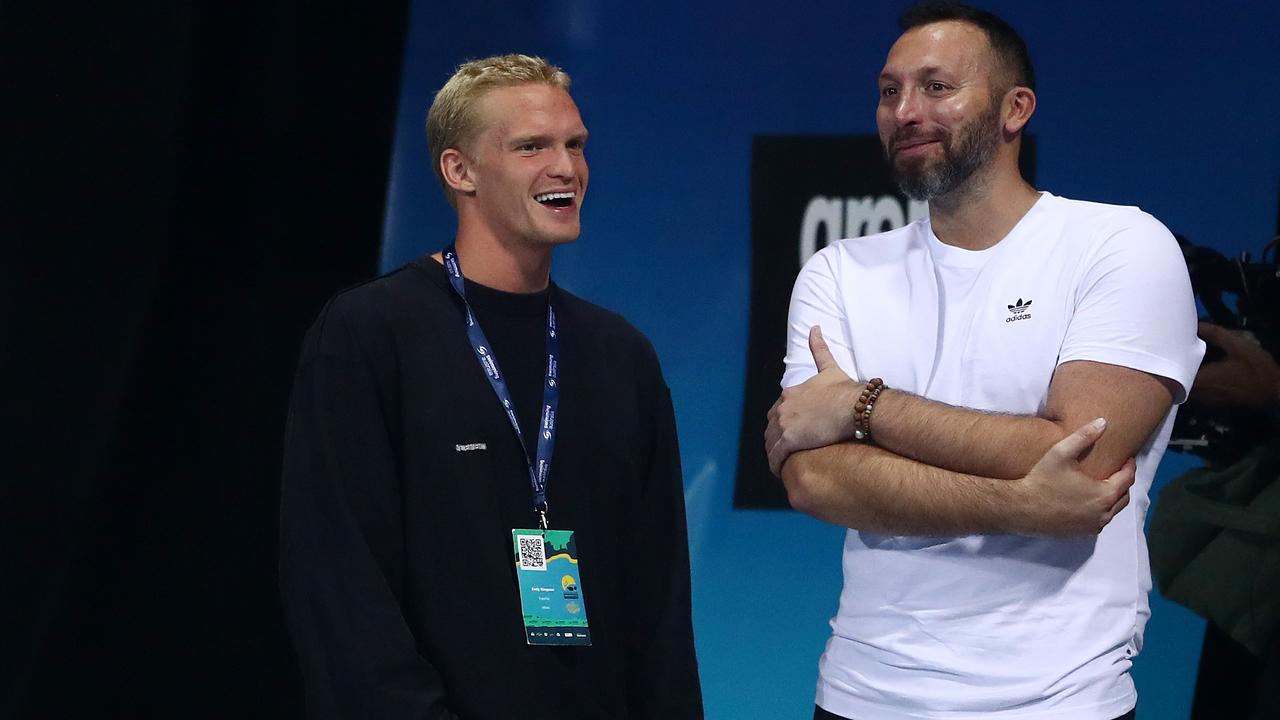 Cody Simpson and Ian Thorpe talk during the 2021 Australian Swimming Championships at the Gold Coast Aquatic Centre. Photo: Getty Images