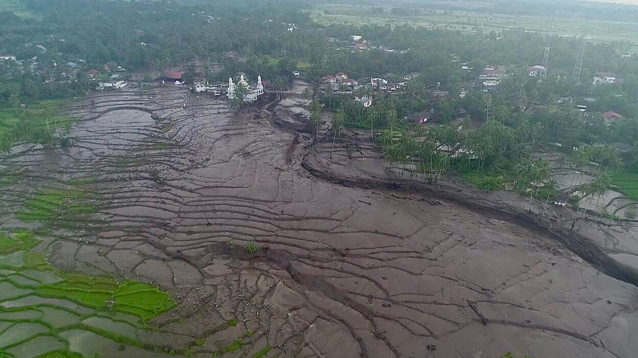 Cold lava is like wet concrete and can crush and bury things in its path. Picture: Handout/Indonesia Disaster Mitigation Agency/AFP