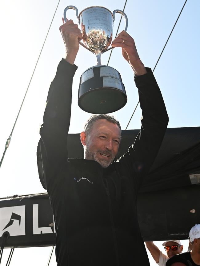 Christian Beck celebrates winning line honours. Picture: Steve Bell/Getty Images