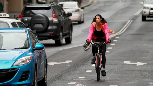 This bike rider didn't even bother with a helmet, let alone a bike lane.