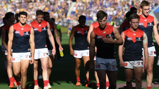 A dejected Jack Viney leads Melbourne off after its preliminary final horror show against West Coast. Picture: AAP Image/Julian Smith.