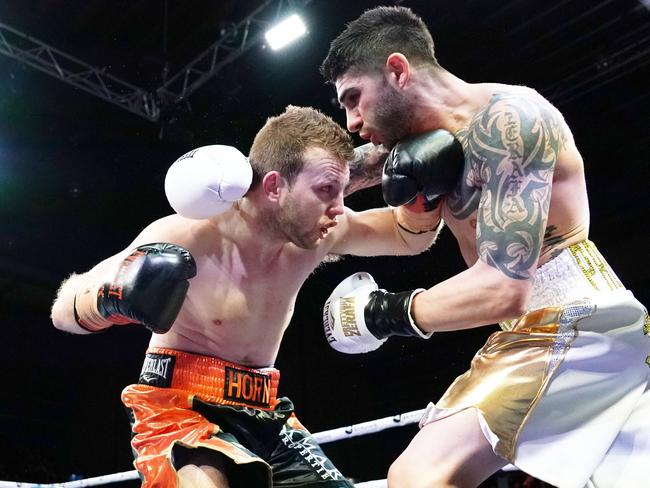 Jeff Horn (left) and Michael Zerafa brawl during the Battle of Bendigo on August 31. (AAP Image/Michael Dodge)