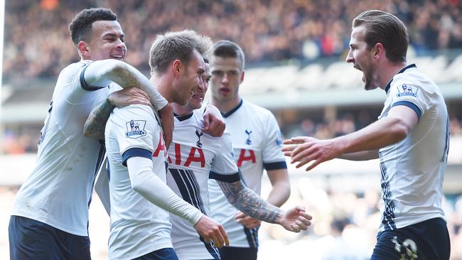 Christian Eriksen (2nd L) of Tottenham Hotspur celebrates scoring his team's first goal.