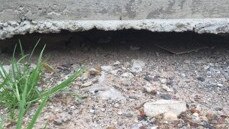 Ground settlement beneath a driveway on Navy Rd, just around the corner from a demolished house in Jordan Springs East. Picture: Supplied.