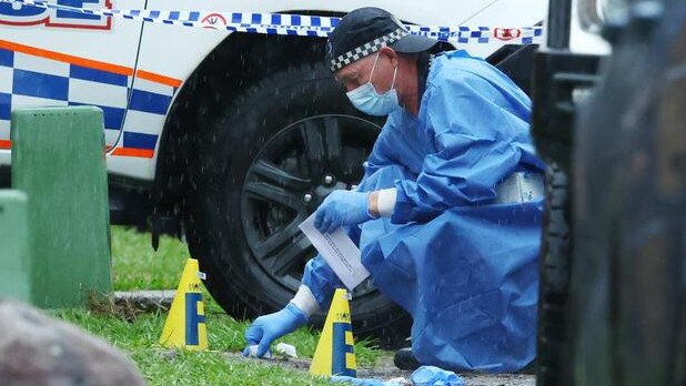 Police investigators search the site in January. Picture: Lachie Millard