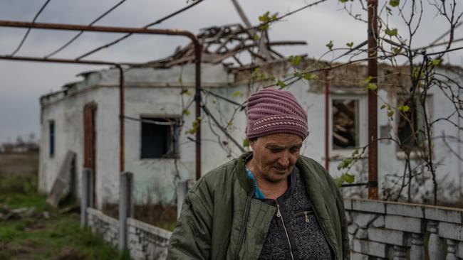 Maria Honta passes her son's house that was heavily damaged during fighting between Ukrainian and Russian occupying forces in Knyazivka, Kherson oblast, Ukraine. Picture: Getty Images