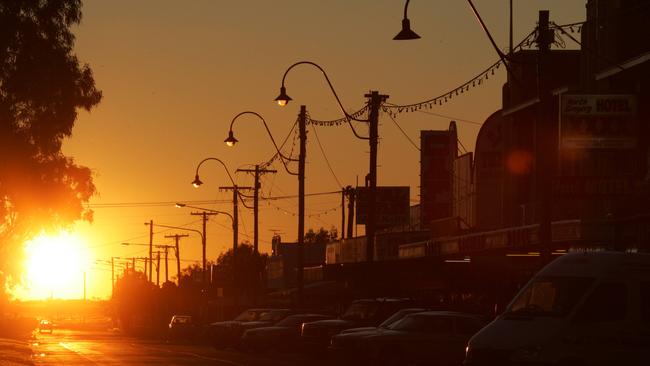 The sun sets over the main street of Winton - just one of many regional towns that finds it hard to attract professionals.