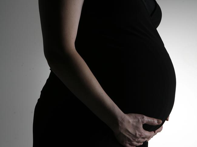 Generic photo of a woman 8 months pregnant.