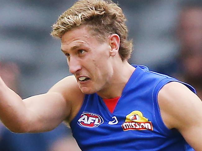 MELBOURNE, AUSTRALIA - APRIL 07: Aaron Naughton of the Bulldogs kicks the ball at goal during the round three AFL match between the Western Bulldogs and the Gold Coast Suns at Marvel Stadium on April 07, 2019 in Melbourne, Australia. (Photo by Michael Dodge/Getty Images)