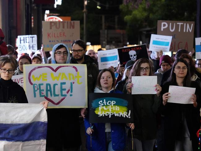 People hold anti-war banners during a protest in Belgrade. Picture: AFP