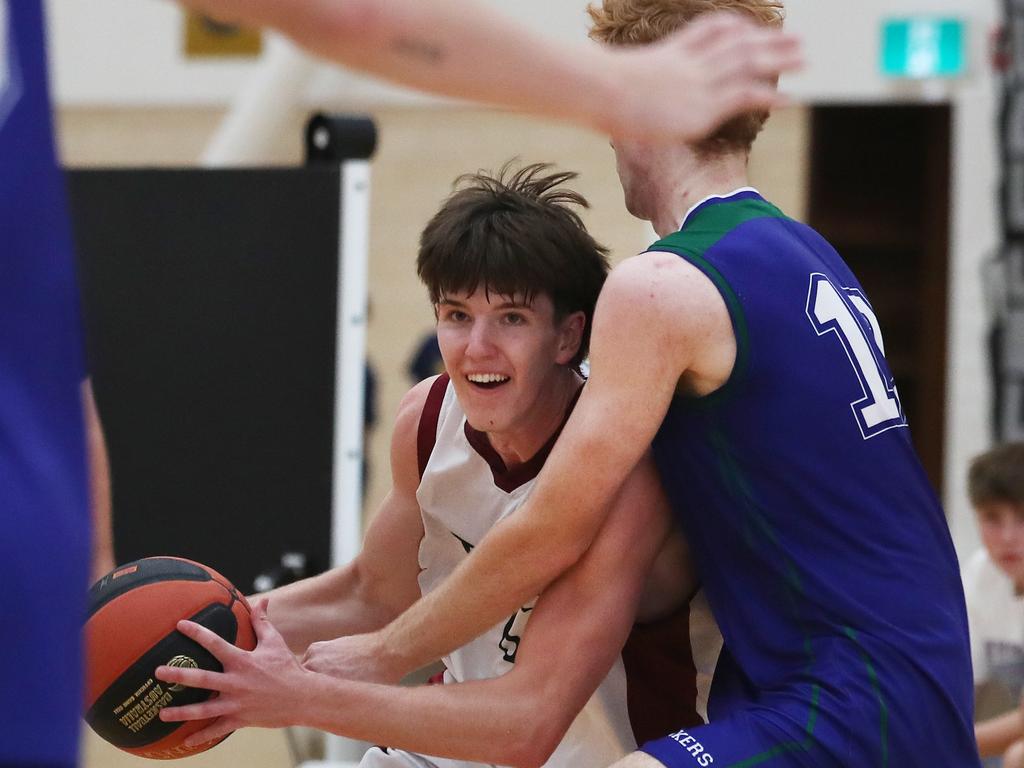 Basketball Australia Schools Championships at Carrara. Mens open final, Lake Ginninderra College Lakers V TSS (in white). the Lakers defence gave Benjamin Tweedy from TSS special attention in the final. Picture Glenn Hampson