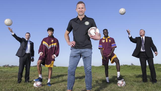 Team 11 ambassador Clint Bolton, at the funding announcement from Casey Council to upgrade Casey Fields into an elite soccer facility if the region wins an A-League licence, is joined by (from left) Councillor Collin Ross, Tejay Lebon, Ronaldo Onen and Casey Mayor Geoff Abblett. Picture: AAP