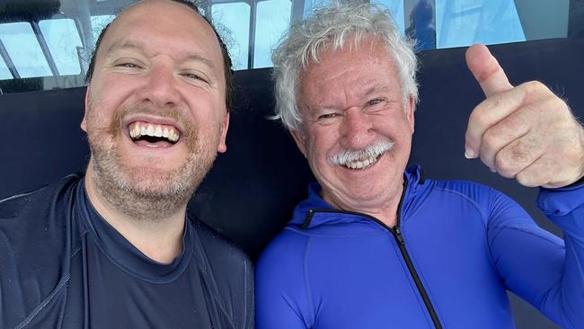 Nicholas Meyer with his father, Adrian Meyer aboard the Reef Experience tour boat near Cairns on Monday, November 20, 2023.