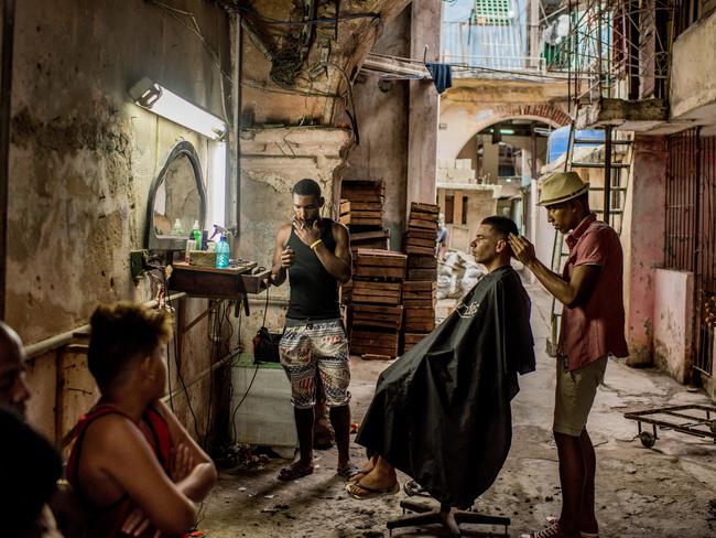 Daily Life - First Prize, Stories © Tomas Munita, for The New York Times Title: Cuba On The Edge Of Change Story: In December, days after Fidel Castro’s death, his ashes were taken into the countryside, on a route that retraced, in reverse, the steps of the revolution he led in 1959. Towns and villages along the route were emptied of residents as thousands tried to catch a glimpse of Castro’s remains. For many, the death of Fidel Castro felt like that of a father. In death, as in life, Fidel Castro demanded reverence. Cuba brims with life, a contrast drawn sharper amid its faded grandeur. From one end of the country to the other, thousands of Cubans waited to bid farewell to Fidel. .