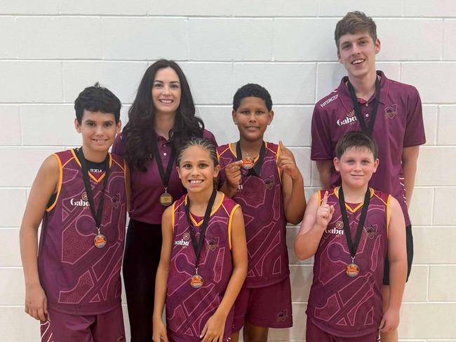 The Rockhampton contingent of the winning Warriors - manager Kassie Hooper, coach Luke Greany, captain Chace Webber, Boston Butler, Anyieth Ayuen and Charlie McGilvary.