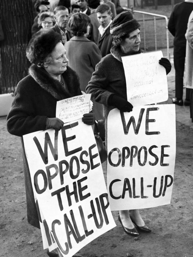 Two protesters oppose conscription.