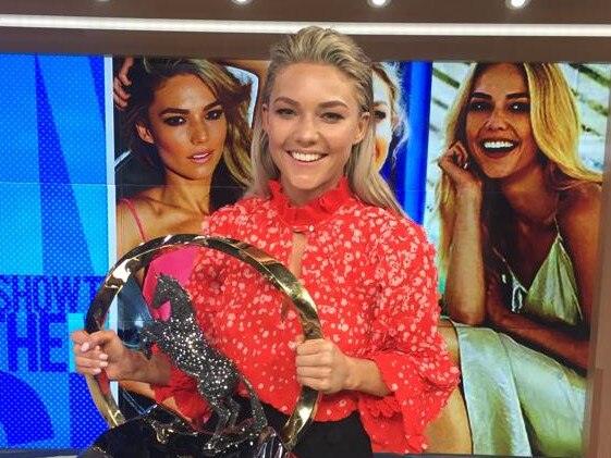 Media personality Sam Frost poses with the TAB Everest trophy.