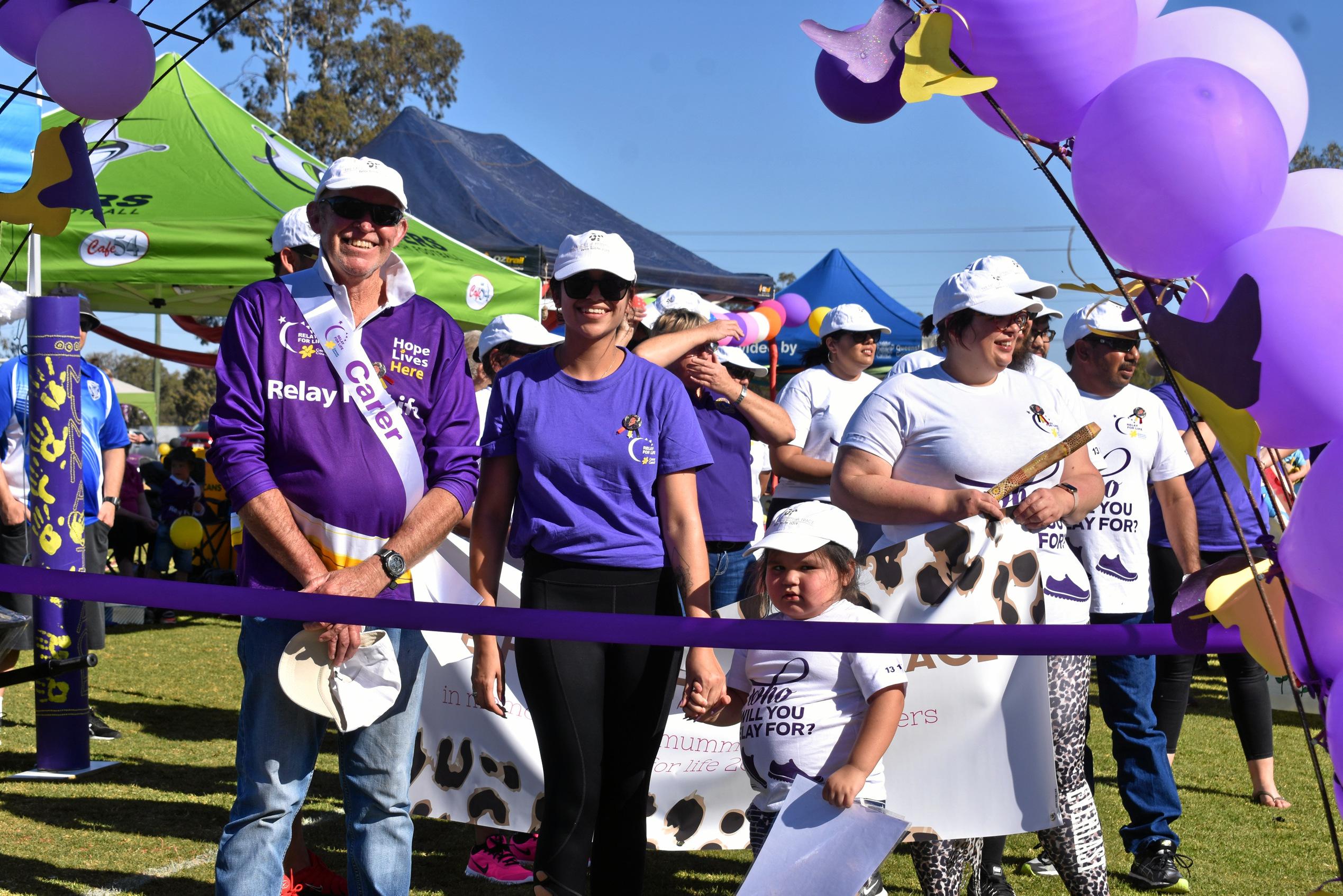 Bryan Vickery and Kaitlyn Landers lead the survivors and carers lap. Picture: Ellen Ransley