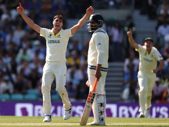 Pat Cummins of Australia celebrates after taking the wicket of Ajinkya Rahane of India before it was ruled a no ball. Picture: Getty Images