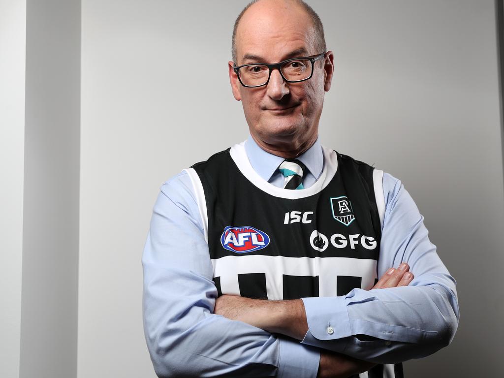 David Koch, Port Adelaide chairman, wearing the clubs black and white striped guernsey