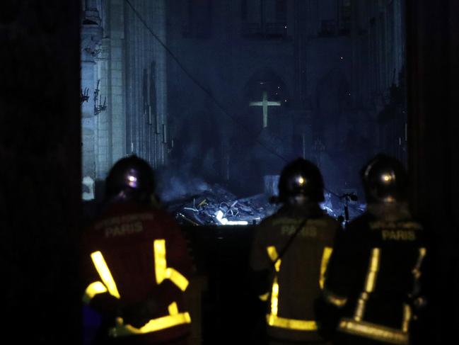 French firemen enter the Notre-Dame Cathedral as flames are burning the roof cathedral in Paris, France, 15 April 2019. EPA/YOAN VALAT