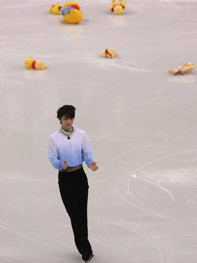 Winnie the Pooh toys are thrown to Yuzuru Hanyu. Picture: Getty Images.