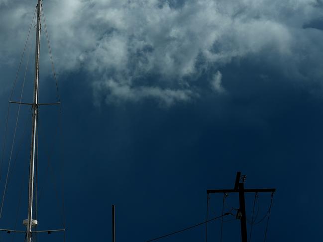 Storm clouds build up as a mast reflects the afternoon sun near Ludmilla Creek on Monday afternoon.Picture: Justin Kennedy