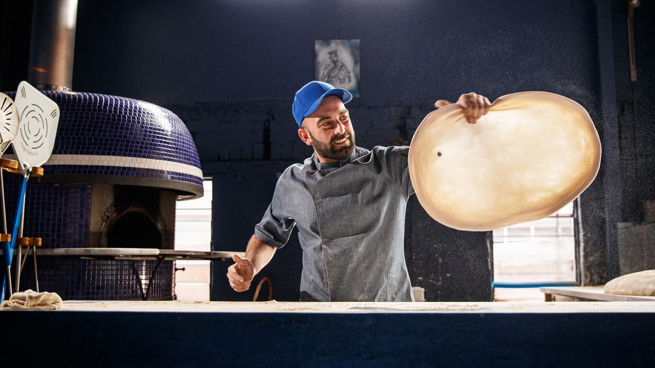 Ettore Bertonati spinning pizza dough at his former restaurant Madre in Adelaide. Picture: Matt Turner