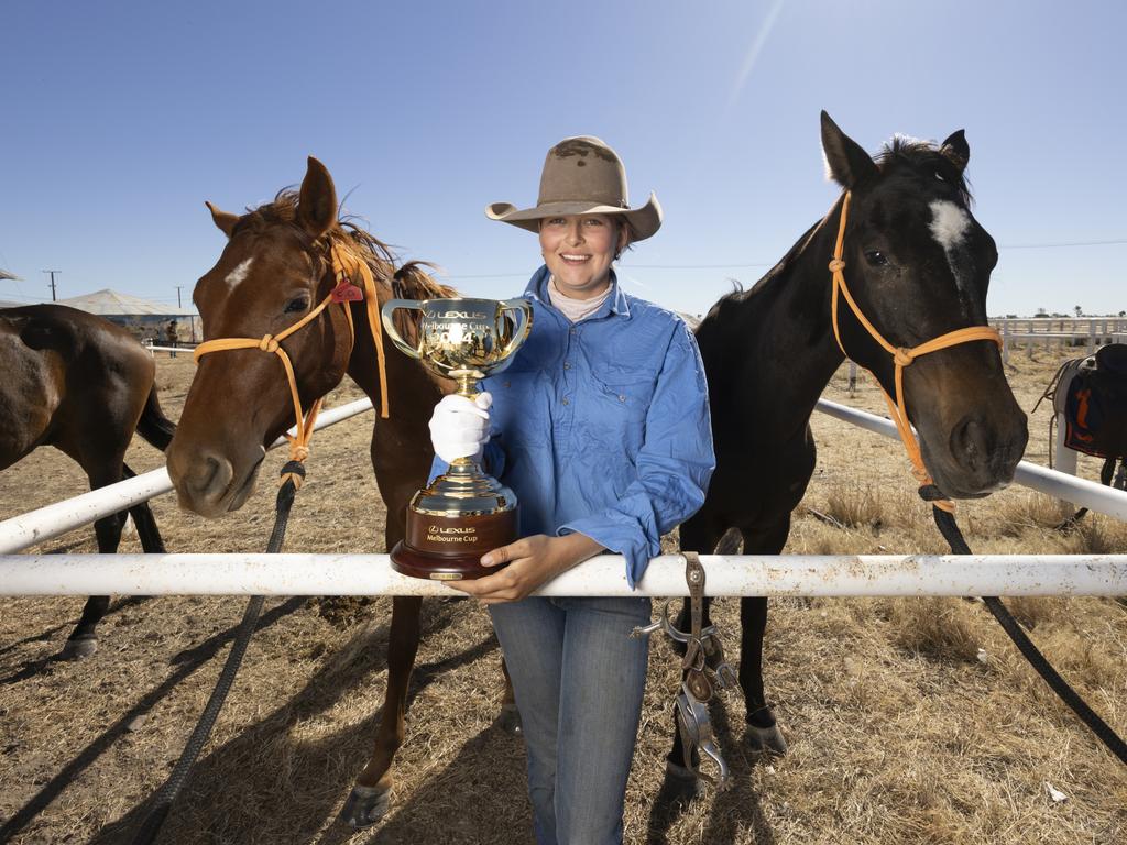 Station hand Amy Kirkwood and the Cup at Anthony Lagoon Station in the Northern Territory as part of the Lexus Melbourne Cup Tour. Picture: Alex Coppel