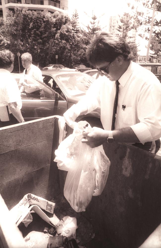 A police officer searching for evidence.