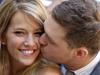 Canadian pop star Michael Buble kisses his bride Argentine TV actress Luisana Lopilato after their brief civil wedding in Buenos Aires, Argentina, March 31, 2011. (AP Photo/Natacha Pisarenko)