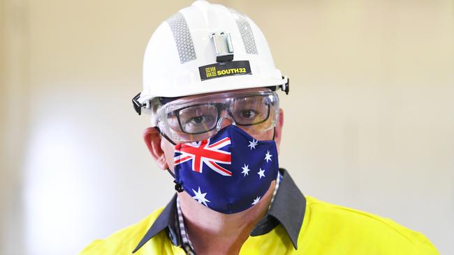 Prime Minister Scott Morrison wears a hard hat and face mask during a visit to South32 Cannington Mine in McKinlay, Queensland. Picture: AAP