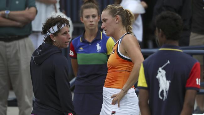 Carla Suarez Navarro, of Spain, left, talks with Timea Babos, of Hungary, after retiring from their first round match at the US Open. Picture: AP