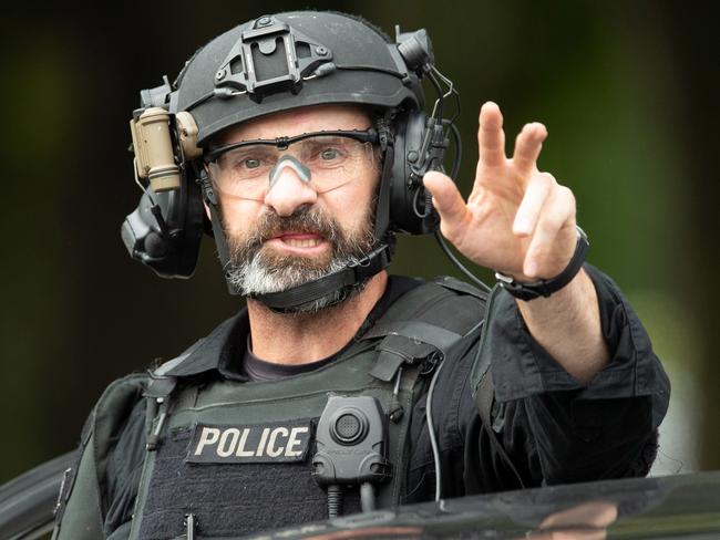 An AOS (Armed Offenders Squad) member is seen following a shooting at the Masjid Al Noor mosque in Christchurch, New Zealand, Friday, March 15, 2019. Multiple people have been killed after a gunman opened fire at two mosques in the New Zealand city of Christchurch. (AAP Image/SNPA, Martin Hunter) NO ARCHIVING