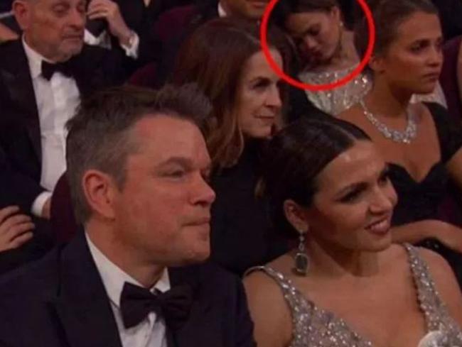 Chrissy Teigen is pictured napping behind Matt Damon and his wife, Luciana. Picture: ABC