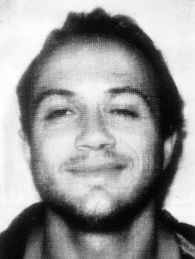 Binse smirks in a police picture.