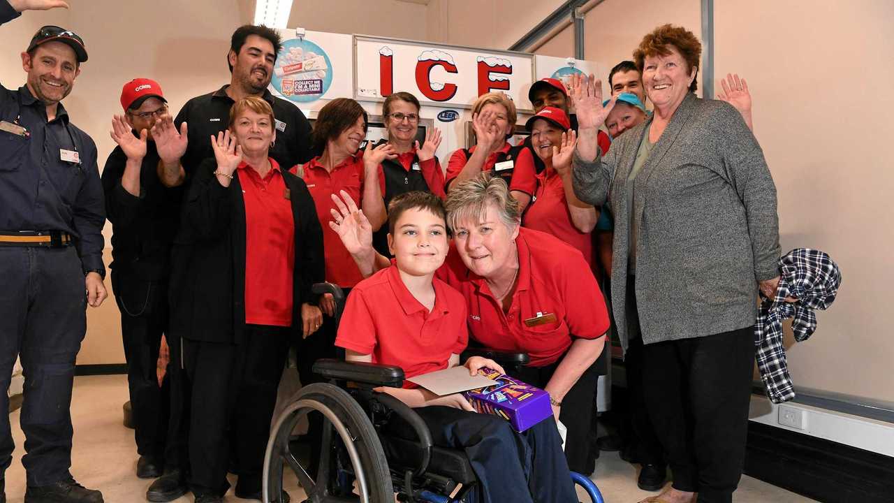 Coles Mooloolaba staff have donated $750 from their social club fund to Kalani Auld, 10, for brand new wheelchair. Coles manager Sharon Wilson is pictured with Kalani in his old wheelchair. Picture: Warren Lynam