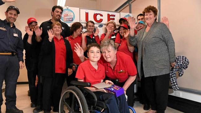 Coles Mooloolaba staff have donated $750 from their social club fund to Kalani Auld, 10, for brand new wheelchair. Coles manager Sharon Wilson is pictured with Kalani in his old wheelchair. Picture: Warren Lynam