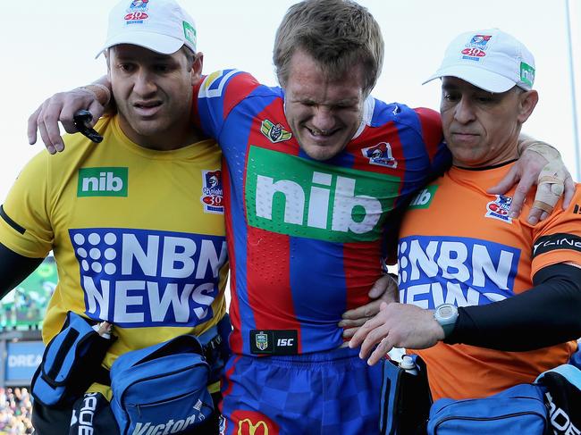 NEWCASTLE, AUSTRALIA - AUGUST 05:  Nathan Ross of the Knights is carried off injured during the round 22 NRL match between the Newcastle Knights and the New Zealand Warriors at McDonald Jones Stadium on August 5, 2017 in Newcastle, Australia.  (Photo by Ashley Feder/Getty Images)