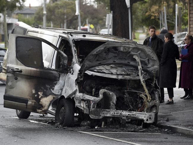 A torched van outside a tobacconist shop on Belair Ave, Glenroy. Picture: Andrew Henshaw