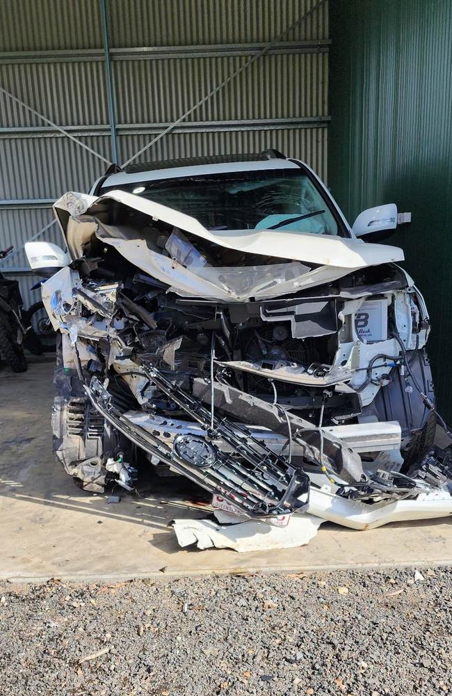 What is left of Amellia Hartman’s brand new white 4WD. She said she was lucky to be alive as the front of the car bore the impact of the collision. Picture: Supplied