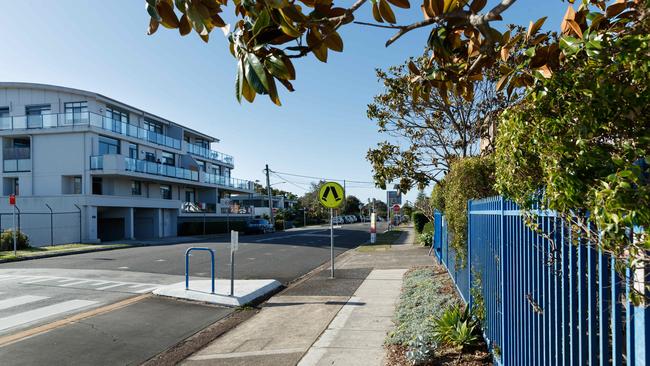 The unit block (left) where former Liberal MP Rory Amon lives, which is across the road from St Joseph’s Catholic Primary School (right). Picture: Max Mason-Hubers