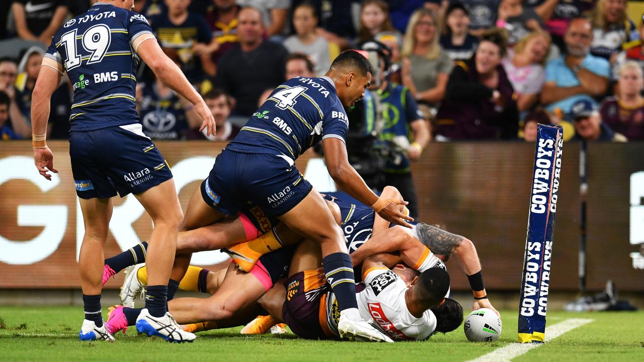 Feldt puts the ball down to complete a remarkable ‘no-look’ try against the Broncos. Picture: Alix Sweeney