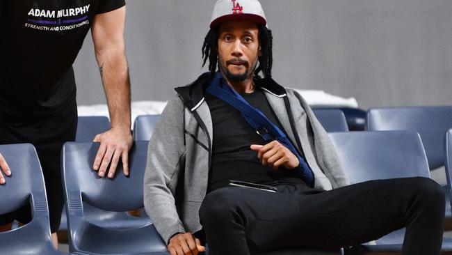 Josh Childress watches training at Adelaide Arena on Tuesday after breaking his left shoulder on Sunday. Picture: David Mariuz (AAP).