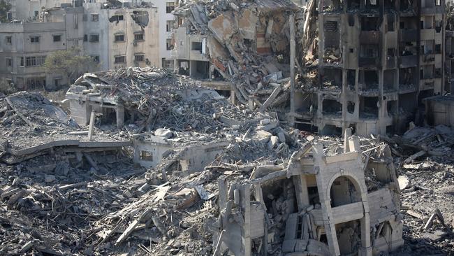 Palestinian citizens inspect damage to their homes caused by Israeli airstrikes on October 13. Picture: Getty